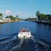 A,Boat,Sails,In,A,Canal,In,Pompano,Beach,,Florida.