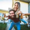 Happy,Young,Couple,Holding,Home,Keys,After,Buying,Real,Estate